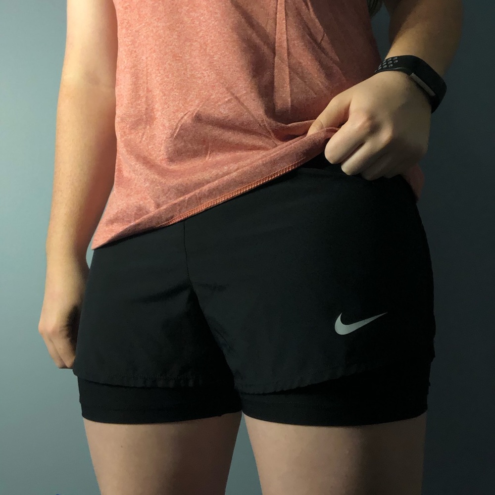 Black Nike running shorts